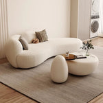 canapé lit blanc bouclé moderne table basse coussins décoratifs