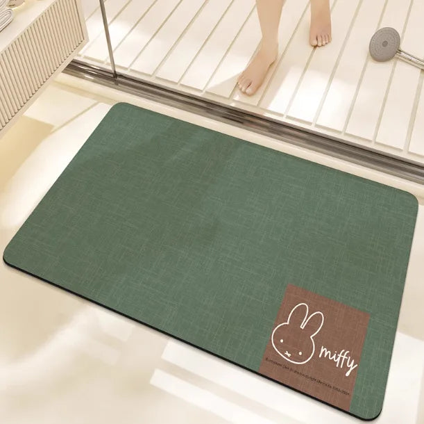 tapis bain dessin animé lapins gris jaune vert bleu rayures enfantin absorbant