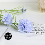 décoration intérieure bouquet fleurs artificielles bleu feuilles vertes moderne minimaliste
