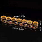 support bougies doré orné pierres semi précieuses motifs floraux artisanal traditionnel bouddhiste cologne française