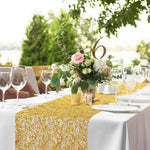 tableau decoratif tissage or blanc vert transparent festif assiettes verres bougies fleurs plantes serviettes
