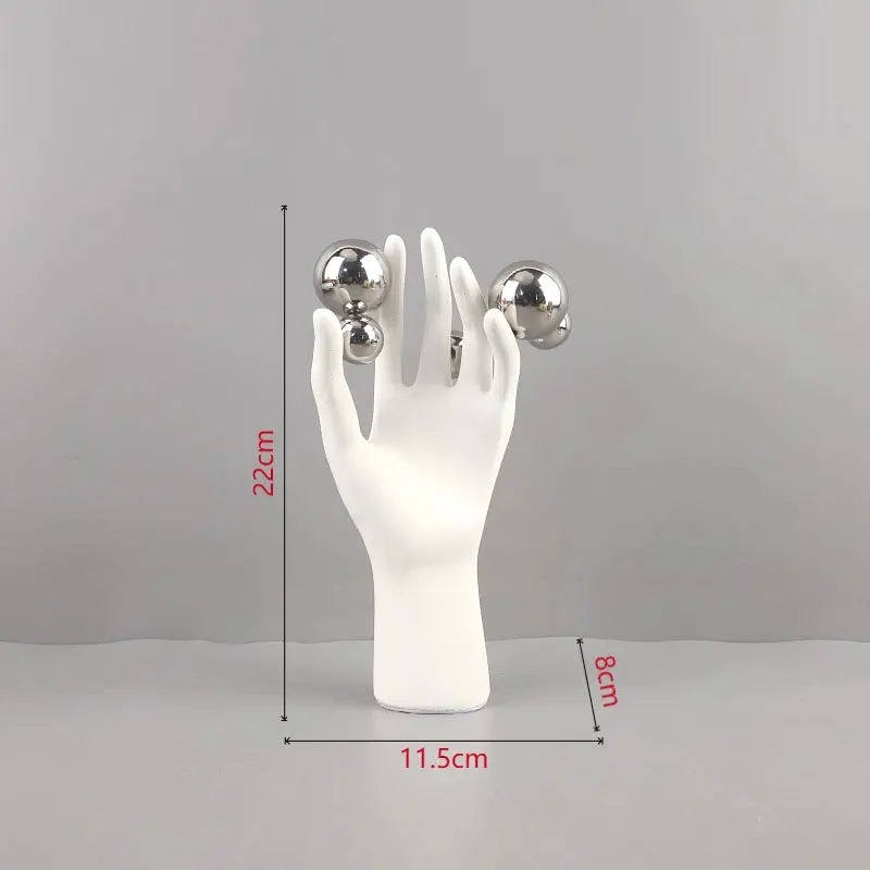 sculpture main humaine sphere argentee deco moderne blanc lisse brillante