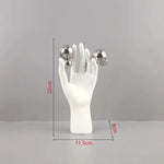 sculpture main humaine sphere argentee deco moderne blanc lisse brillante