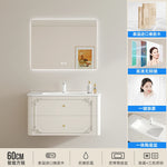meuble salle bain noir blanc tiroirs vasque ornements dorés classique fixations murales accessoires cosmétiques