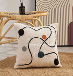 housse coussin brodé motif géométrique moderne coton blanc décoration intérieure carreau 45x45cm opaquet fixations