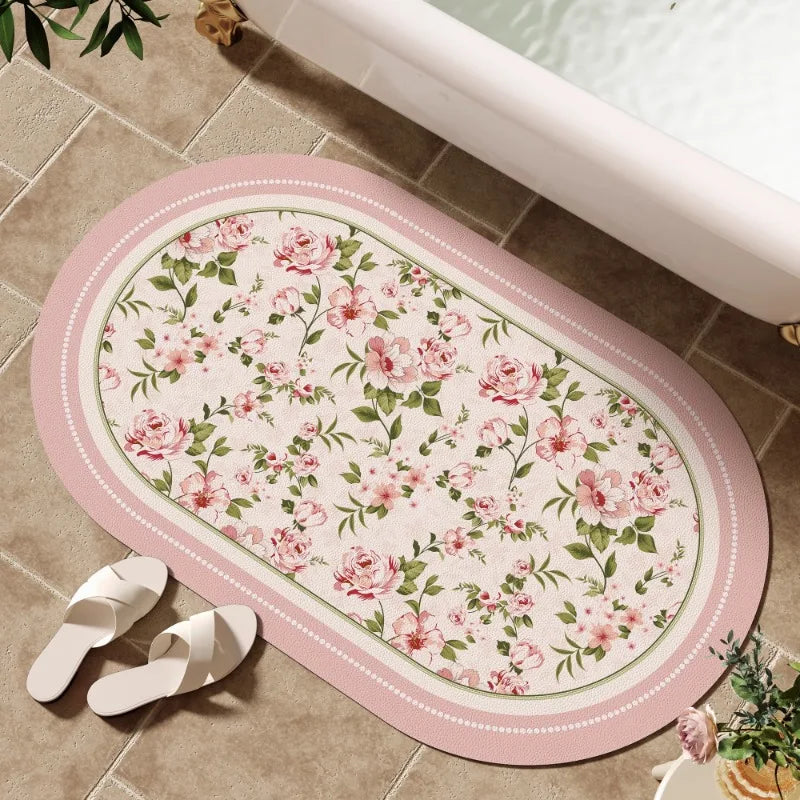 tapis bain rose clair fleurs vertes bordure ornée résistant décoloration moderne classique ovale 40x60cm