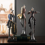 statues musiciens noir bleu doré texture métallique art deco instruments musicaux base solide vintage