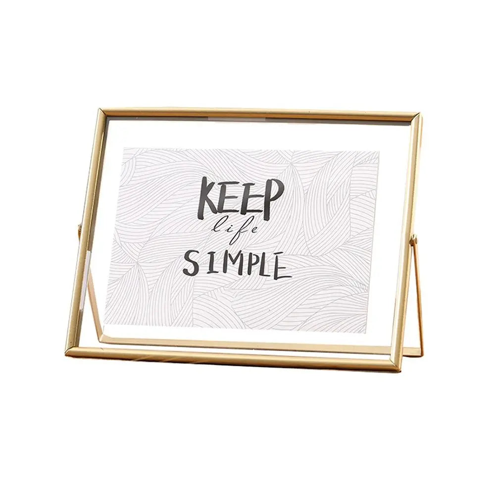 cadre photo moderne minimaliste or noir pieds triangulaires texte simple verre