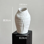 vase poterie moderne gris beige fleur séchée décoration intérieure texture marbrée lisse rustique arrangement