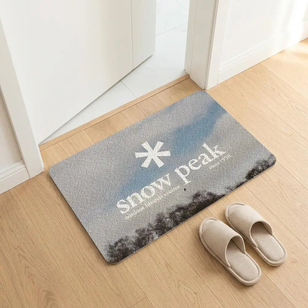 tapis sol noir logo snow peak minimaliste antidérapant bain moderne camping usage