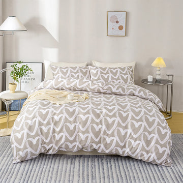 ensemble literie housse couette deux taies d'oreiller coeur gris blanc moderne