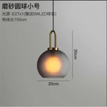 suspension lumineuse moderne gris fumé doré verre mat métal poli ampoule filament visible chambre