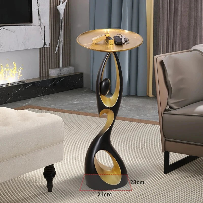 table basse moderne artistique plateau rond noir or blanc
