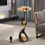 table basse moderne artistique plateau rond noir or blanc