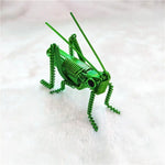 décoration créative insecte vert spirale métallique artisanal étagère unique adorable fait main exposé yeux