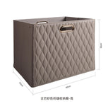 boîte rangement cuir matelassé poignées métalliques chambre moderne