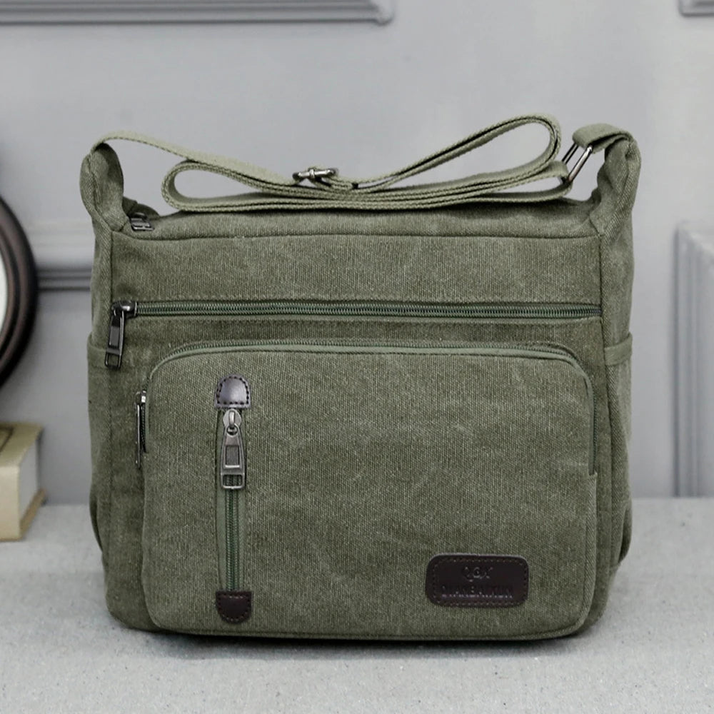 sac bandoulière homme toile vert olive marron beige gris poches zippées sangles réglables urbain