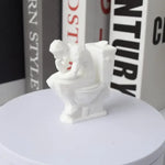 statue humoristique penseur assis toilettes blanc artistique parodie