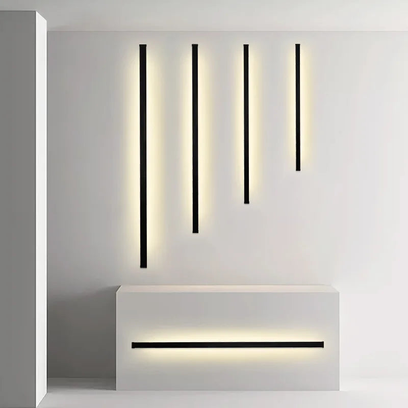 Détail de l'applique murale LED noire montrant son éclairage d'angle doux