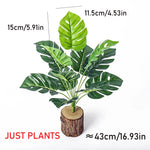 plantes artificielles monstera vert feuilles larges modernes decoration exterieure tronc bois pot ceramique