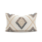coussin décoratif boho chic blanc bleu marron beige doré motifs géométriques pompons coton