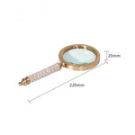 décoration vintage loupe or marron poignée cuir serpent transparente élégante maison