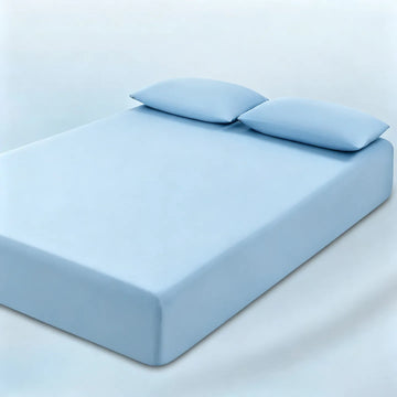 parure lit bleu clair drap housse élastique deux oreillers coton doux chambre moderne