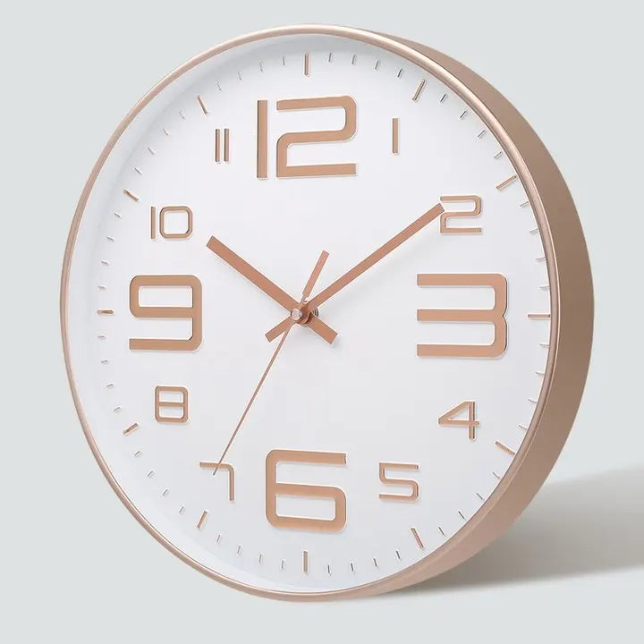 horloge murale moderne chiffres relief aiguilles fines blanc rose doré noir minimaliste