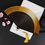 éventail pliant traditionnel vert foncé noir marron clair décoration mariage accessoire fête parfumé chinois