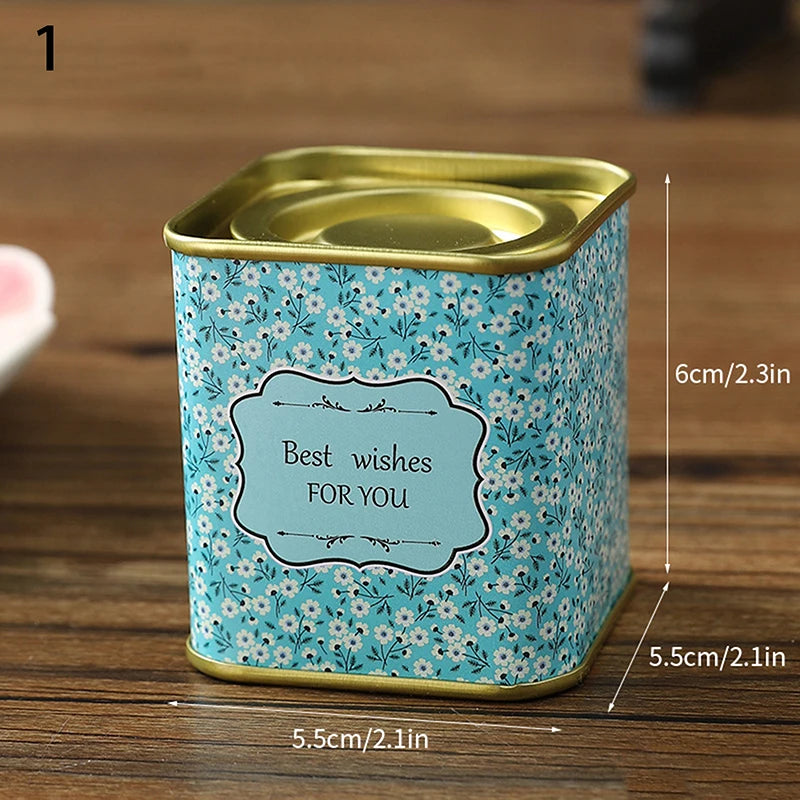 boîtes métal bleu rose noir fleurs vintage capsules étiquettes messages conservation snacks thé
