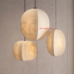 suspension lumineuse moderne minimaliste blanc beige texture toile opacité chaînes noires lumière neutre chaude