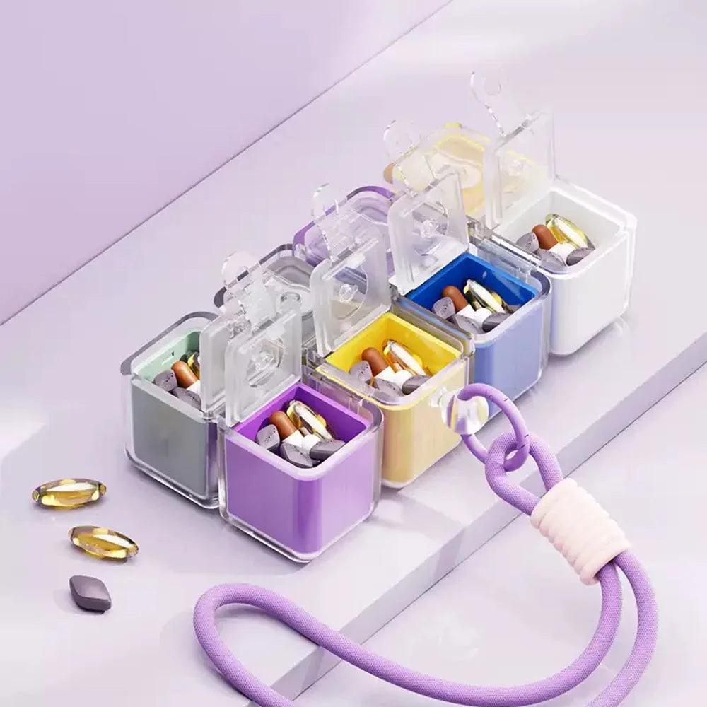 cube rangement médicaments violet blanc vert jaune moderne compartiments cordelette portable organisation