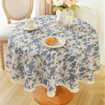nappe ronde fleur bleue motif floral rustique franges table beige