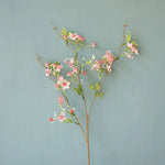 décoration intérieure fleurs artificielles soie rose blanc jaune vert branches feuilles vases transparents printemps