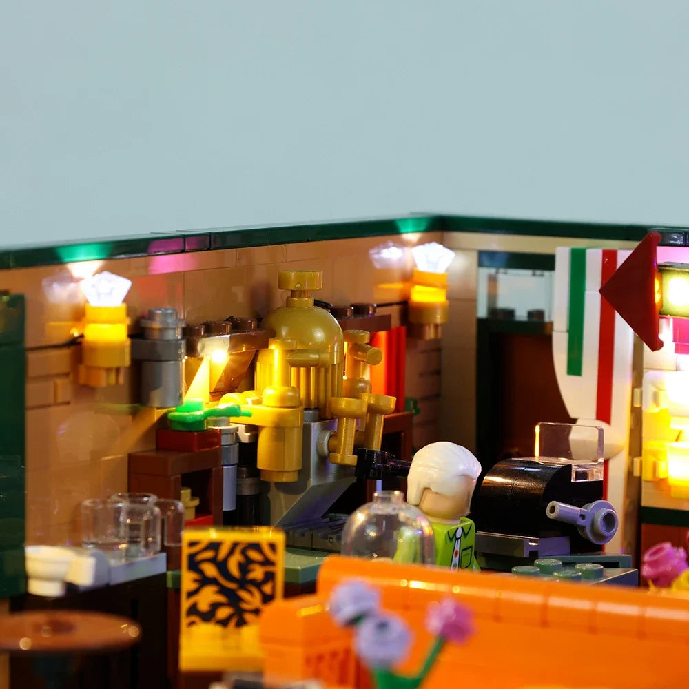 maquette lego détaillée adhésif lumineuse couleurs vives canapé bar étagères affiches