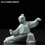 statues arts martiaux traditionnelles gris clair texture granite opaques artisanal modernes motifs traditionnels