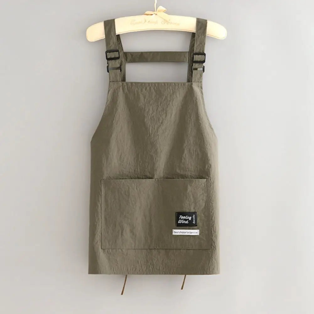 Tablier professionnel vert moderne pour coiffure et cuisine