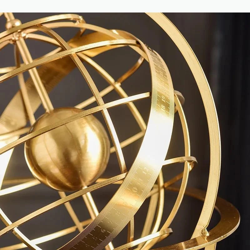 sculpture géométrique moderne sphère dorée anneaux circulaires décoration chambre minimaliste