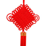 guirlande traditionnelle chinoise tissée artisanale rouge motifs géométriques pompon ruban doré festive printemps