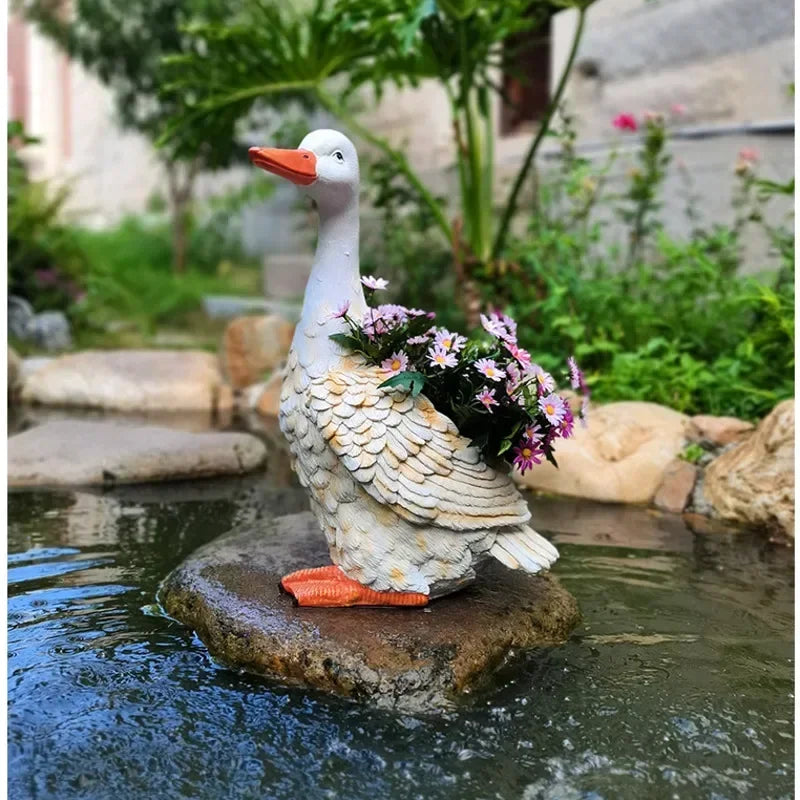 statue canard blanc plumes orange piscine jardin décoration extérieure animaux ornements paysagistes fleurs artificielles