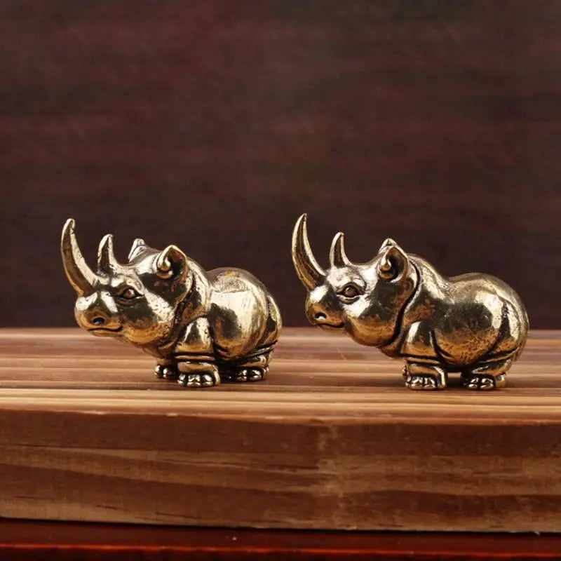 figurines animales bronze cuivre détails sculptés rhinocéros hippopotame éléphant plateau bois africain