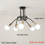 suspension lumineuse moderne noir doré ampoules blanches structure spirale fixation câbles métallique