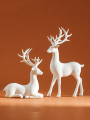 décoration intérieure noël figurines cerfs modernes blanc doré festive table