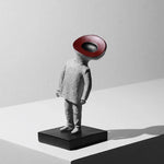 figurines humaines stylisées abstraction contemporaine sculpture rugueuse lisse gris clair rouge foncé noir salon