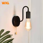 lampe murale moderne fer noir fixe 15cm largeur 18cm hauteur interrupteur ampoule