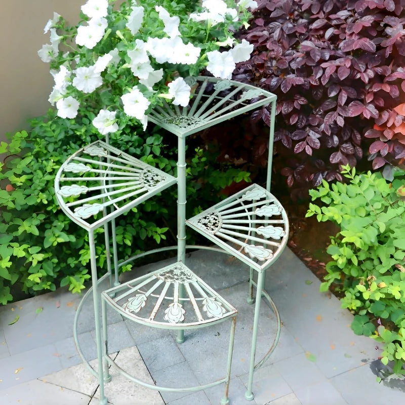étagère plante métal vert clair motifs floraux structure ajourée vintage pieds ronds balcon jardin