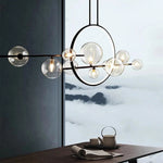 suspension lumineuse moderne noir boules transparentes scandinave chaînes suspendues interrupteur poussoir lumière salon cuisine