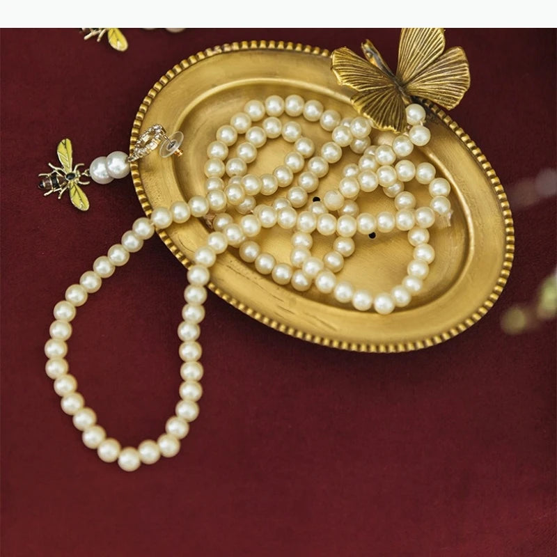 assiette ovale dorée bord dentelé motif oiseau fleur vintage bijoux savon bougie porte bijoux