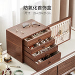 coffret bijoux bois marron tiroirs poignées dorées rangement moderne minimaliste