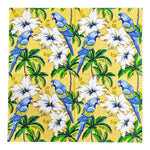 serviettes table papier motif tropical perroquets fleurs palmiers jaune bleu vert hibiscus pliées dépliées
